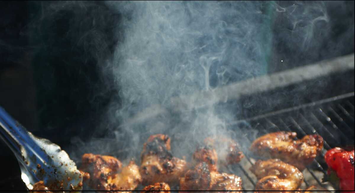 Smoke rising from the charcoal grill
